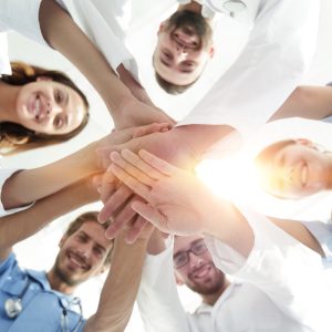 Students stand in a circle and join their hands